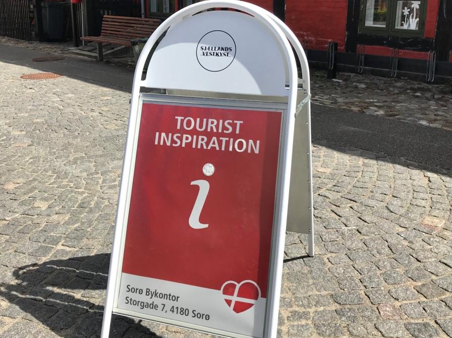 Fotografi af Tursitinspirationsskilt